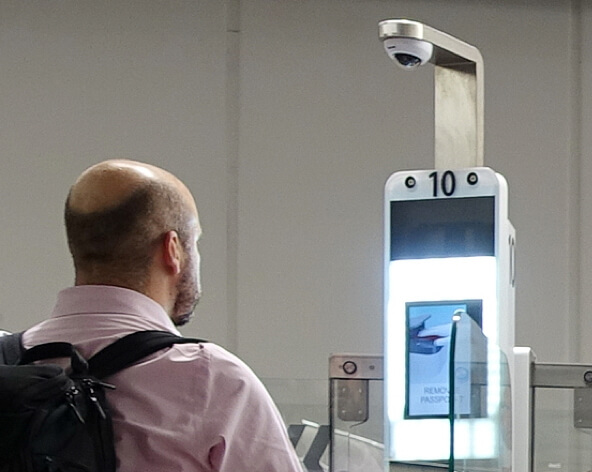 Man at facial recognition machine