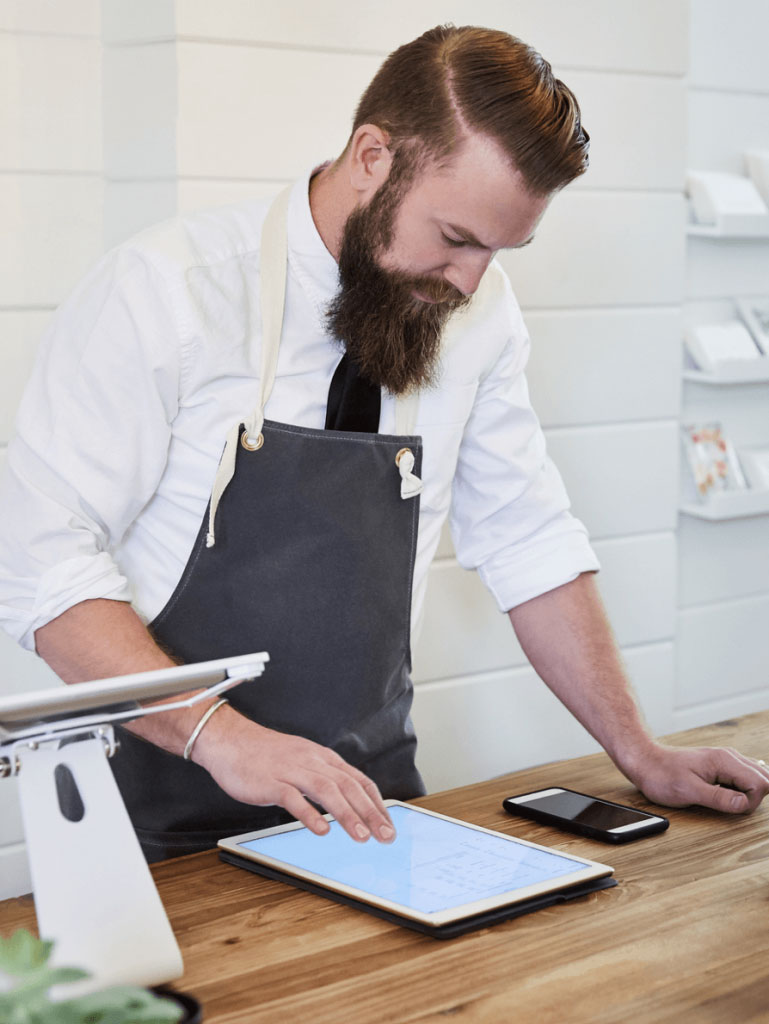 Retail employee using iPad in store
